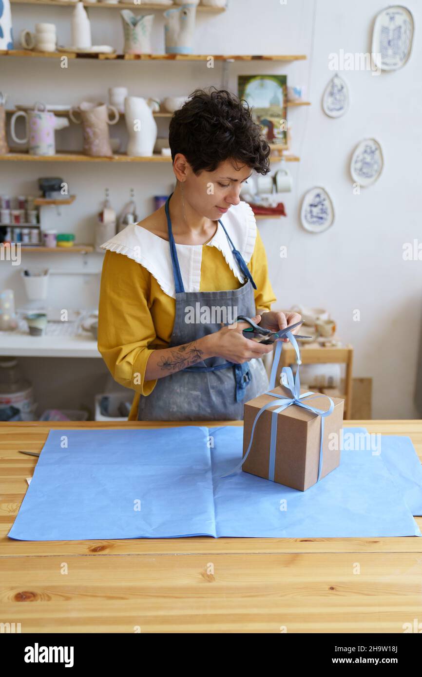 Shipping production to consumer female craft ceramics shop owner