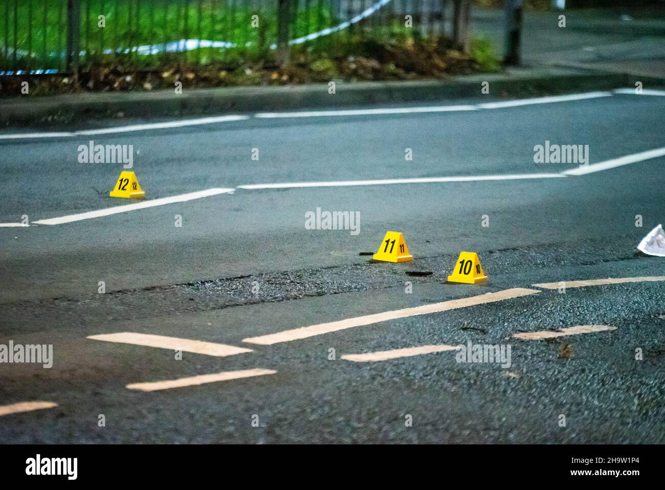 Yellow forensics cones on the road after a serious hit-and-run crash in Erdington, Birmingham, UK Stock Photo