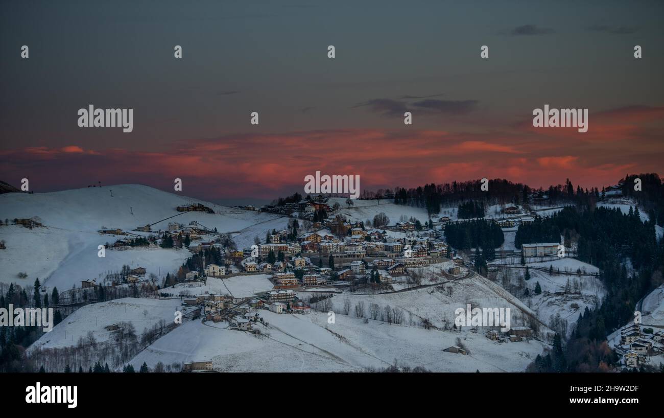 snowy mountain village at sunset Stock Photo - Alamy