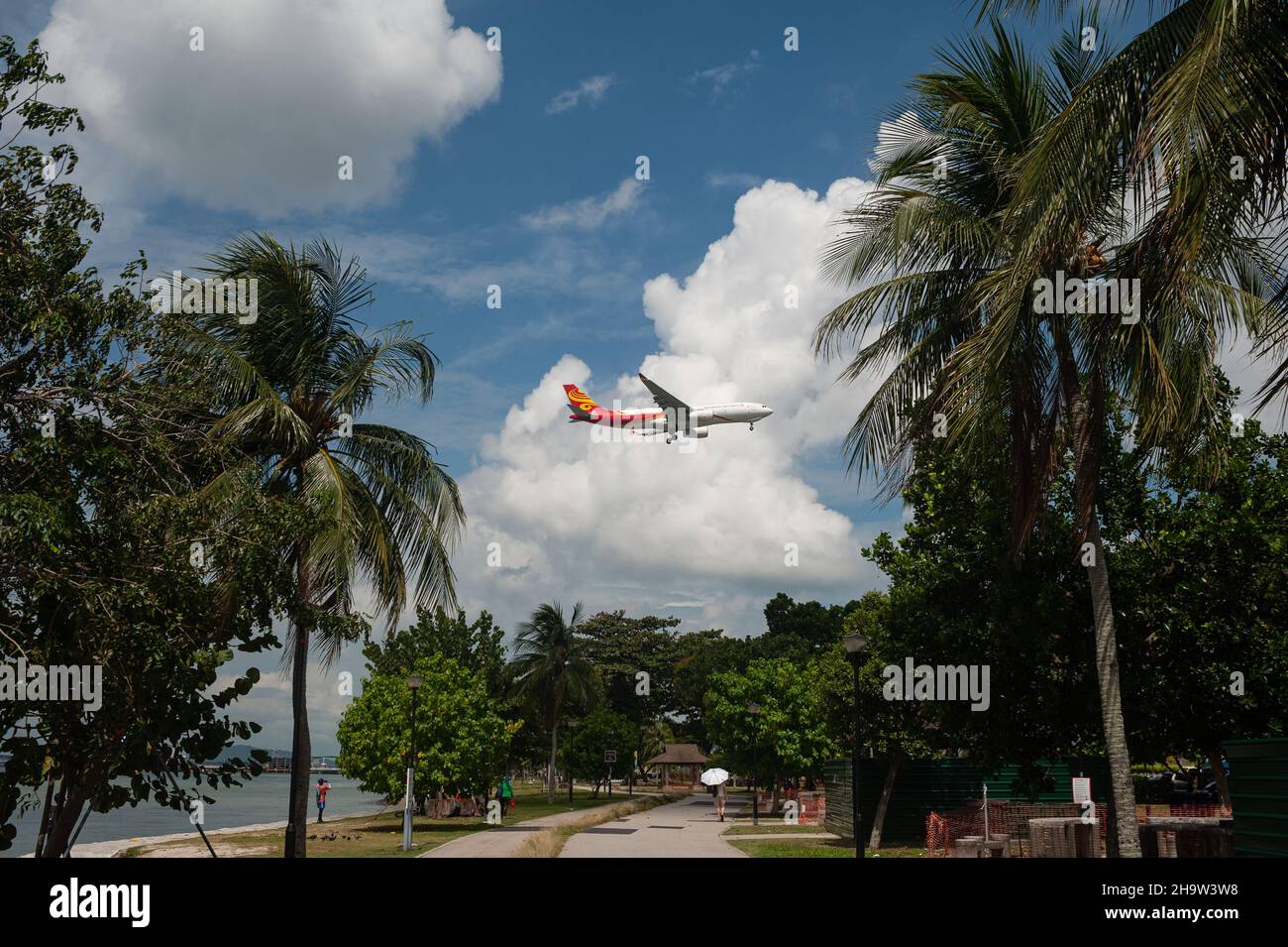 '10.08.2021, Singapore, , Singapore - A Hong Kong Air Cargo cargo plane flies over Changi Beach Park before landing at Changi International Airport.. Stock Photo