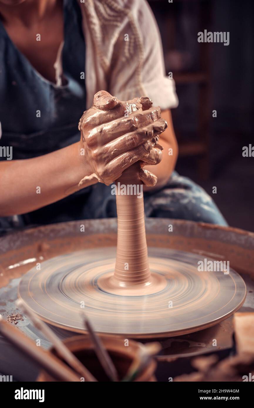 production process of pottery. Forming a clay teapot on a potter's