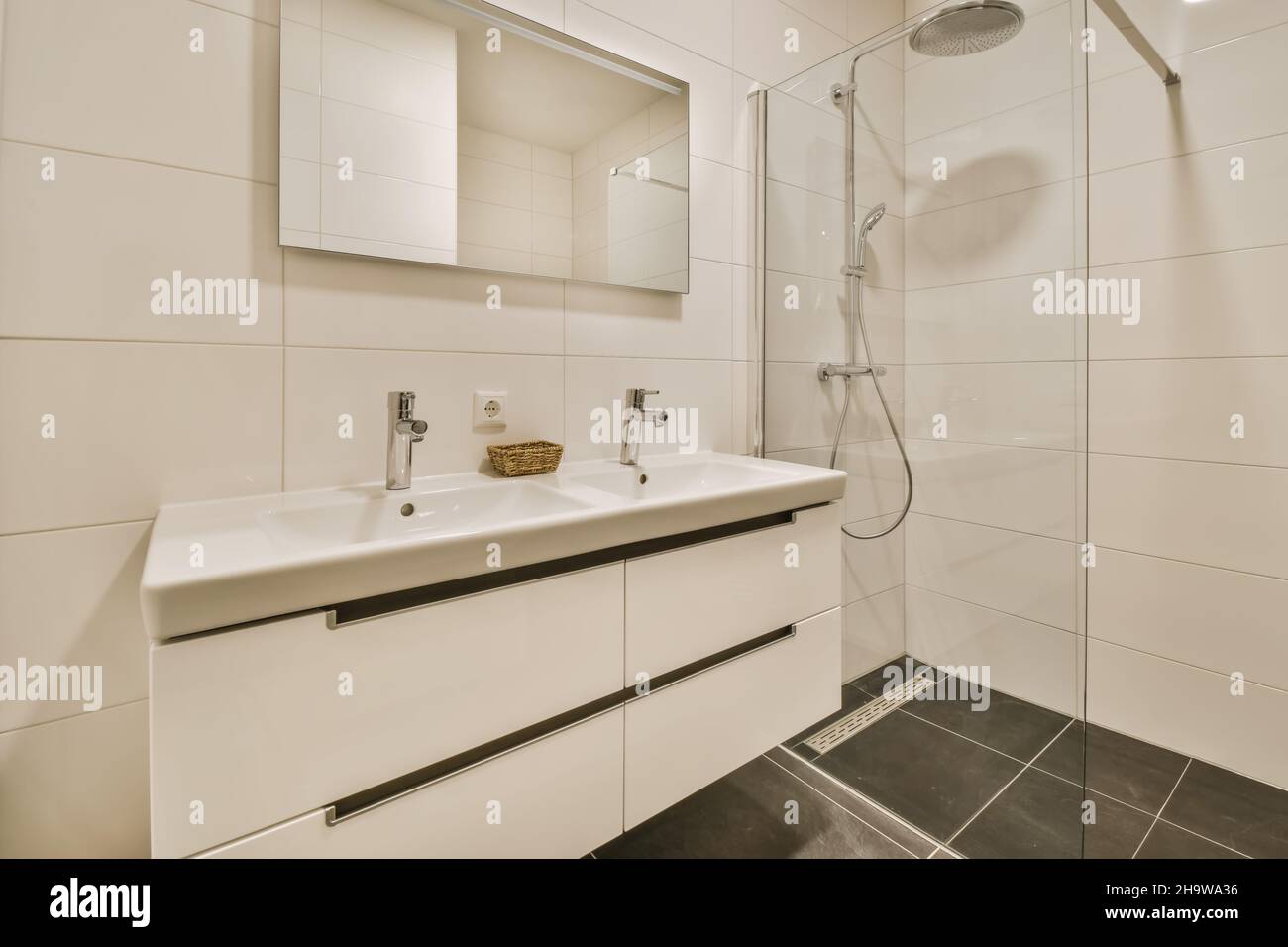 Luxurious bathroom with a hanging chest of drawers with a sink Stock Photo