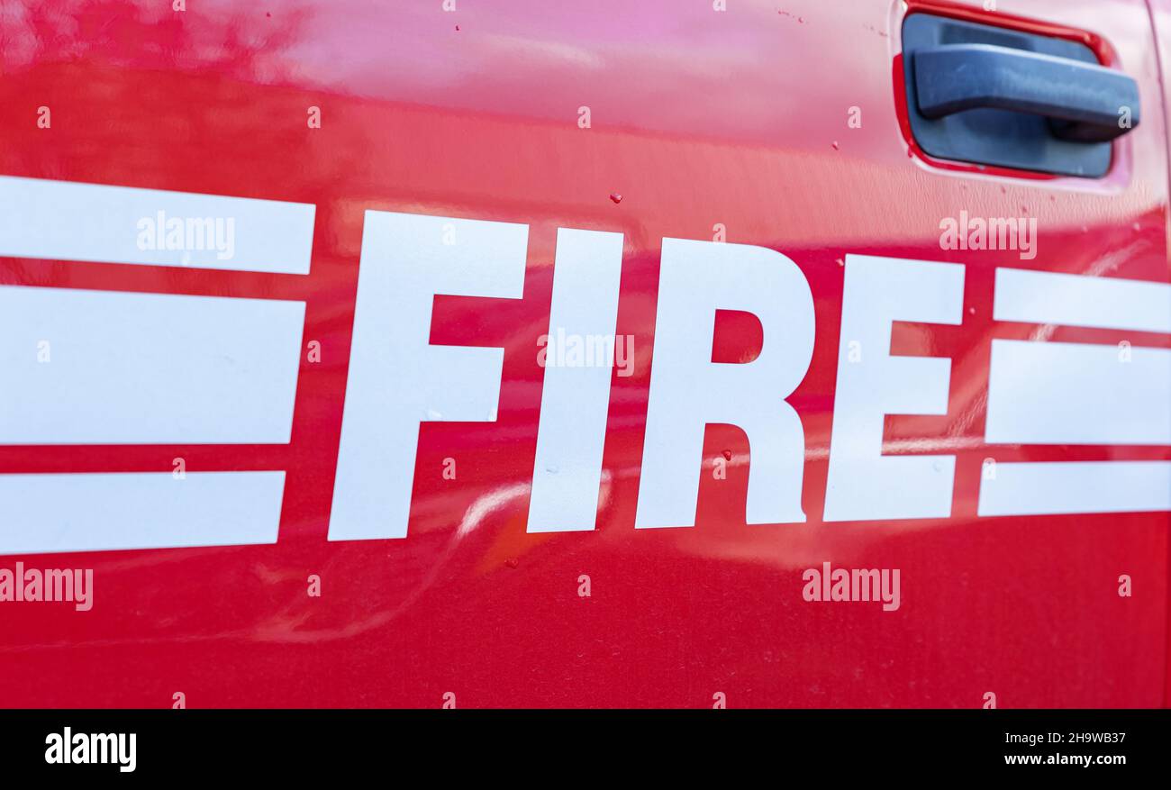 Close up of FIRE sign on the front of a BC Langley fire servise vehicle. Fire rescue service vehicle of Langley department. Street view, nobody, selec Stock Photo