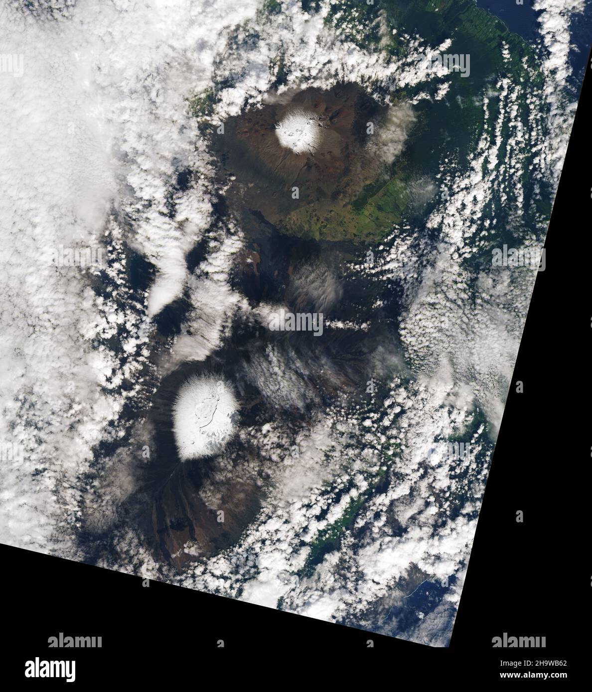 December 7, 2021 - Hawaii - A low-pressure system called a 'kona low' developed northwest of Hawaii in the first week of December 2021, dropping snow on the peaks of Mauna Kea and Mauna Loa. The storm also brought high winds, intense rainfall, and flash flooding, along with reports of landslides, downed trees, and power outages. Some roads and schools were closed, and Hawaii Governor declared a state of emergency. On Oahu, the Honolulu airport received 7.92 inches (20.12 centimeters) of rain on December 6, breaking the single-day record for December. (Credit Image: © NASA Earth/ZUMA Press Wire Stock Photo