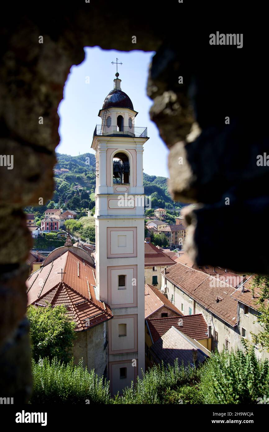 Vertical shot of a church tower seen through a wall Stock Photo - Alamy