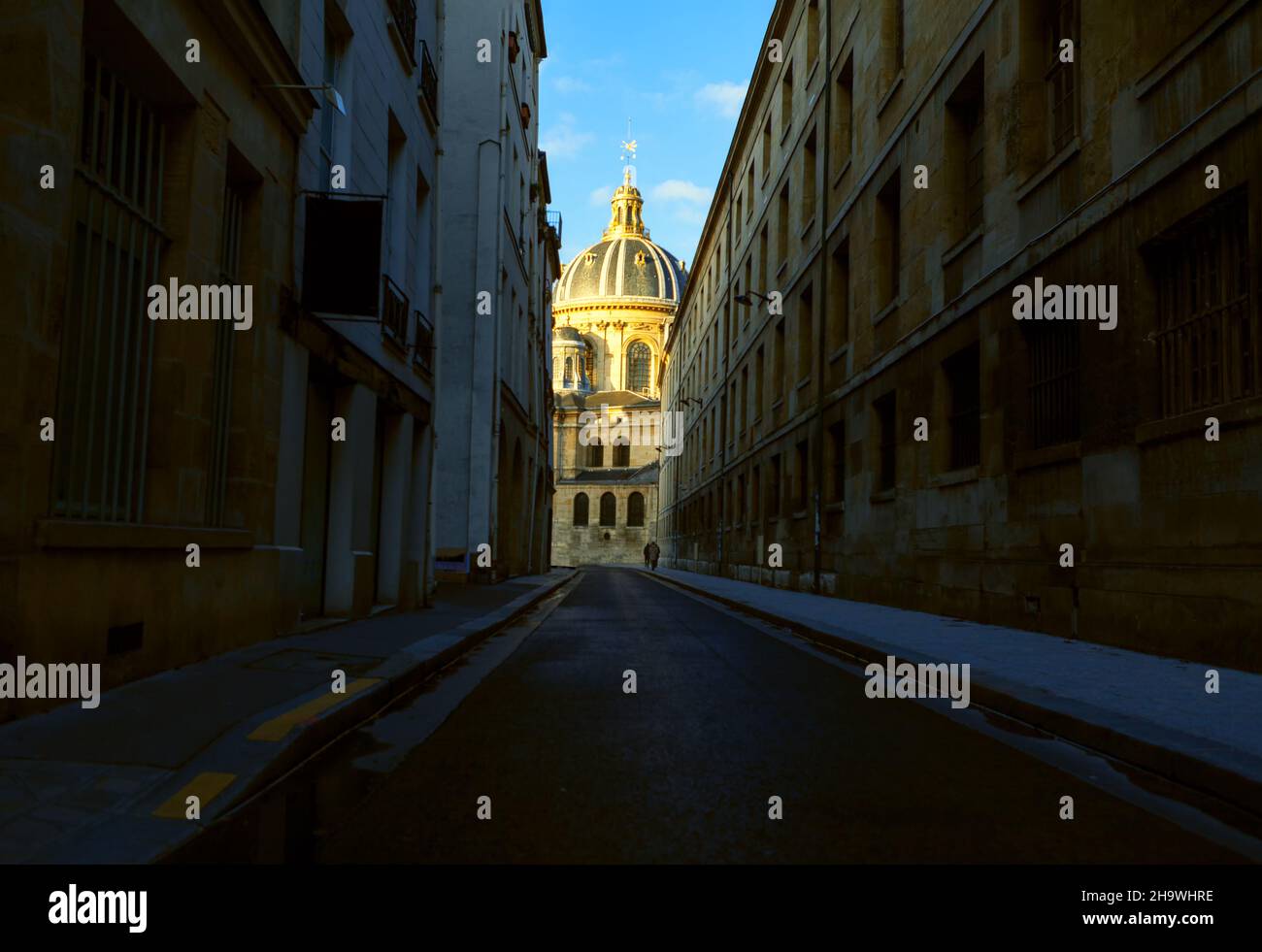 Cathedral on the end of the street . Narrow street of Paris Stock Photo