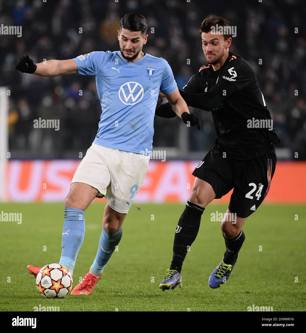Turin, Italy. 8th Dec, 2021. FC Juventus' Daniele Rugani (R) vies with Malmo's Antonio Colak during the UEFA Champions League Group H match between FC Juventus and Malmo in Turin, Italy, Dec. 8, 2021. Credit: Federico Tardito/Xinhua/Alamy Live News Stock Photo