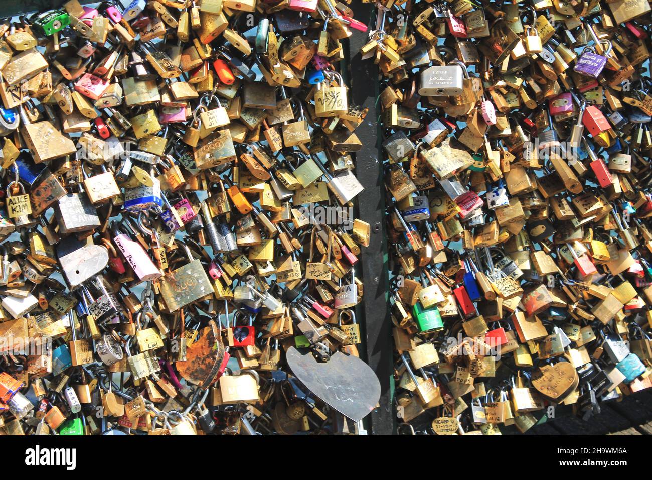‘Love Locks’ on Pont des Arts bridge over the River Seine, Paris, France. In 2015 the city set out to remove the locks, which were damaging the bridge Stock Photo