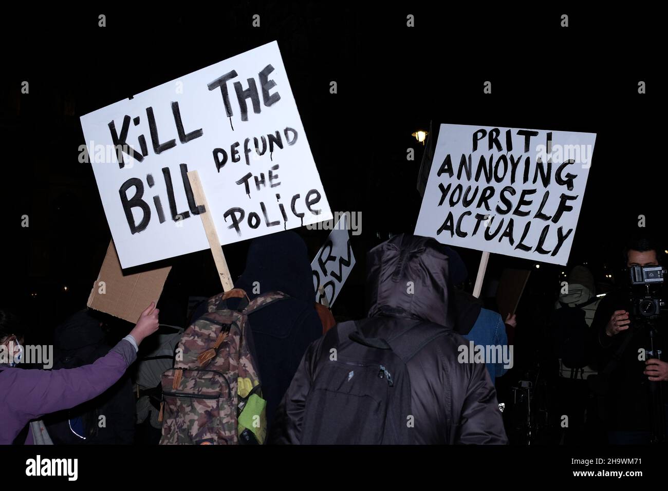 London, UK, 8th Dec, 2021, 'Kill the Bill' protesters hold up placards in Westminster as the third reading of the Police, Crime, Sentencing and Courts Bill (PCSC) got underway in the House of Lords. The new legislation, if passed, will grant police additional powers to crack-down on protest by allowing stop-and-search, data sharing of activists details and the breaking-up of demonstrations deemed as causing 'serious annoyance'. Campaigners say the bill will also criminalise the Gypsy, Roma and Traveller communities way of life. Credit: Eleventh Hour Photography/Alamy Live News Stock Photo