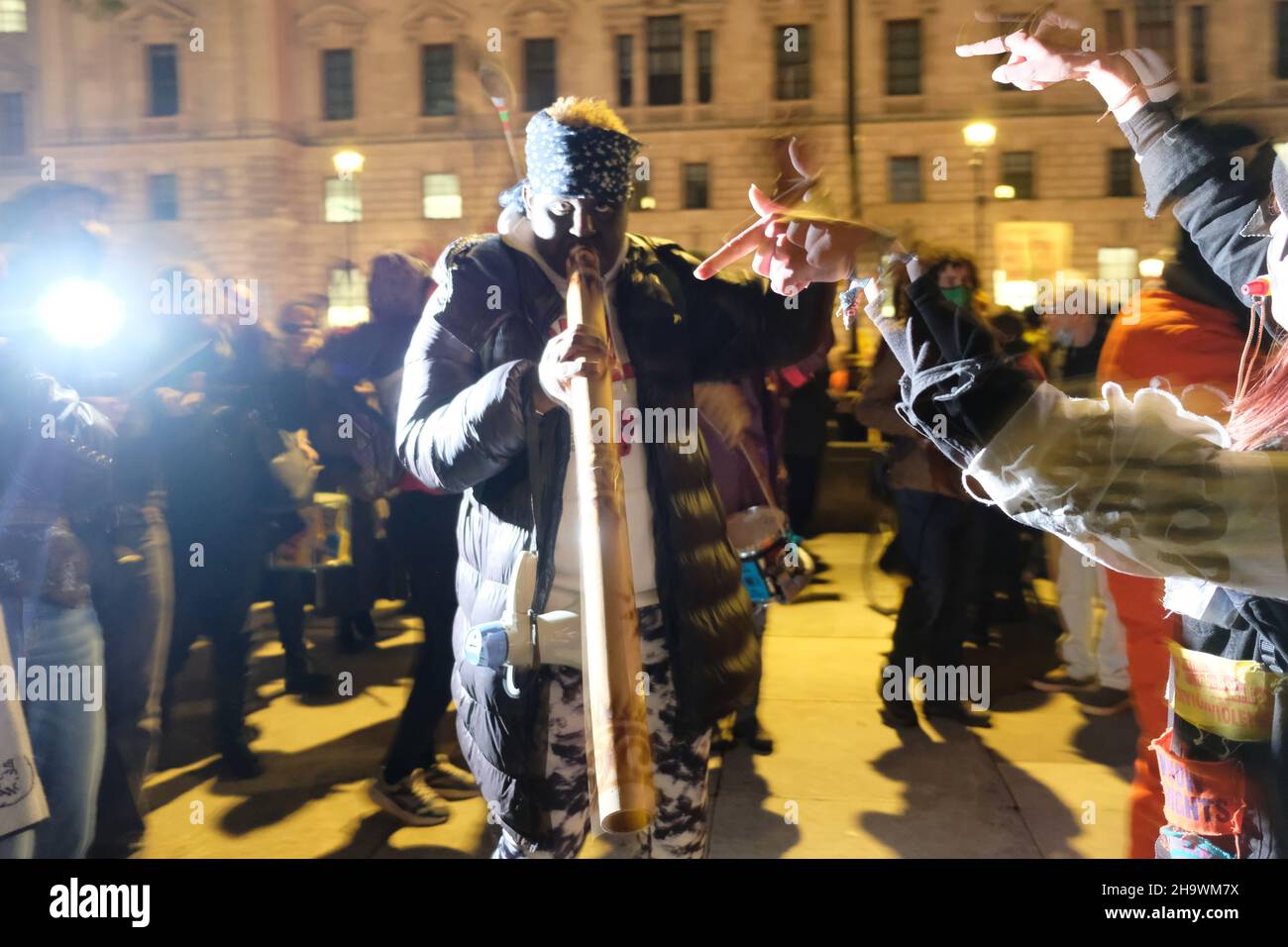 London, UK, 8th Dec, 2021, 'Kill the Bill' protesters, one playing a didgeridoo and others, drums, gathered in Westminster as the third reading of the Police, Crime, Sentencing and Courts Bill (PCSC) got underway in the House of Lords. The new legislation, if passed, will grant police additional powers to crack-down on protest by allowing stop-and-search, data sharing of activists details and the breaking-up of demonstrations deemed as causing 'serious annoyance'. Credit: Eleventh Hour Photography/Alamy Live News Stock Photo