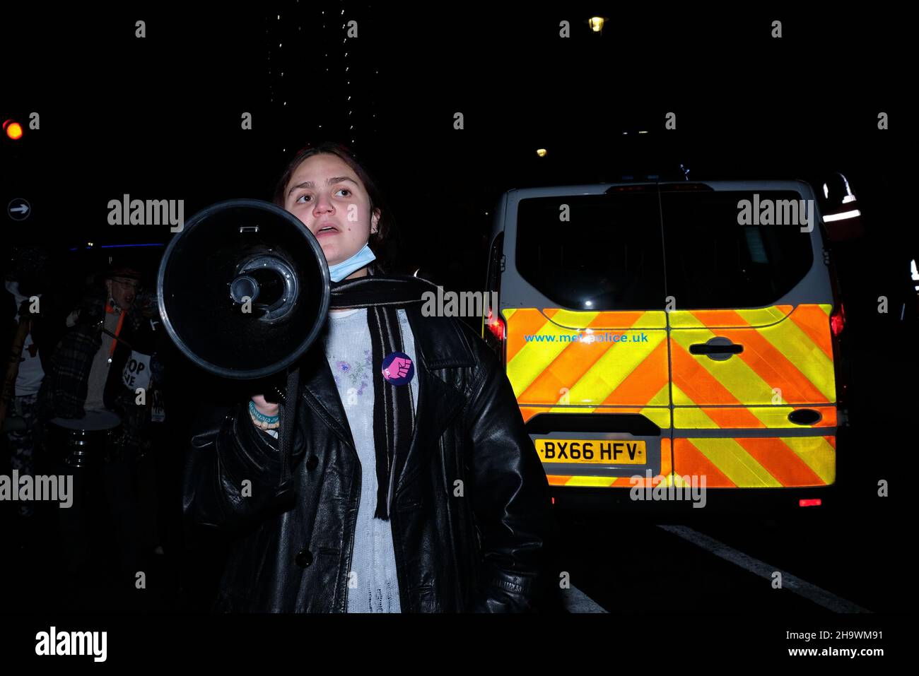 London, UK, 8th Dec, 2021, A 'Kill the Bill' protester shouting slogans through a megaphone in Westminster as the third reading of the Police, Crime, Sentencing and Courts Bill (PCSC) got underway in the House of Lords. The new legislation, if passed, will grant police additional powers to crack-down on protest by allowing stop-and-search, data sharing of activists details and the breaking-up of demonstrations deemed as causing 'serious annoyance'. Credit: Eleventh Hour Photography/Alamy Live News Stock Photo