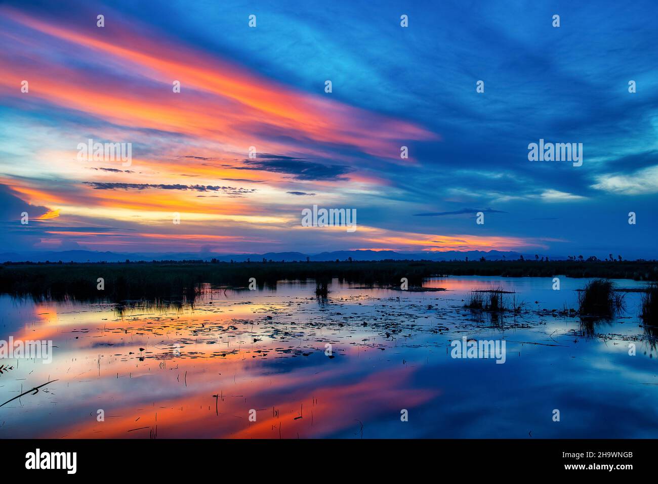 Fire sunrise over calm sea hi-res stock photography and images - Alamy