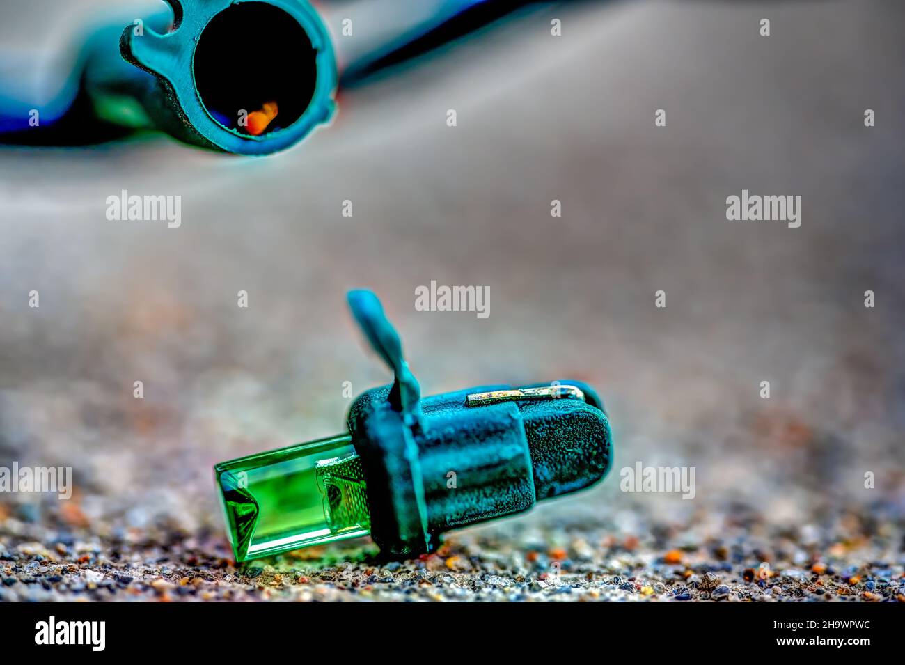 Focus on replacement bulb for a string of Christmas lights to repair a