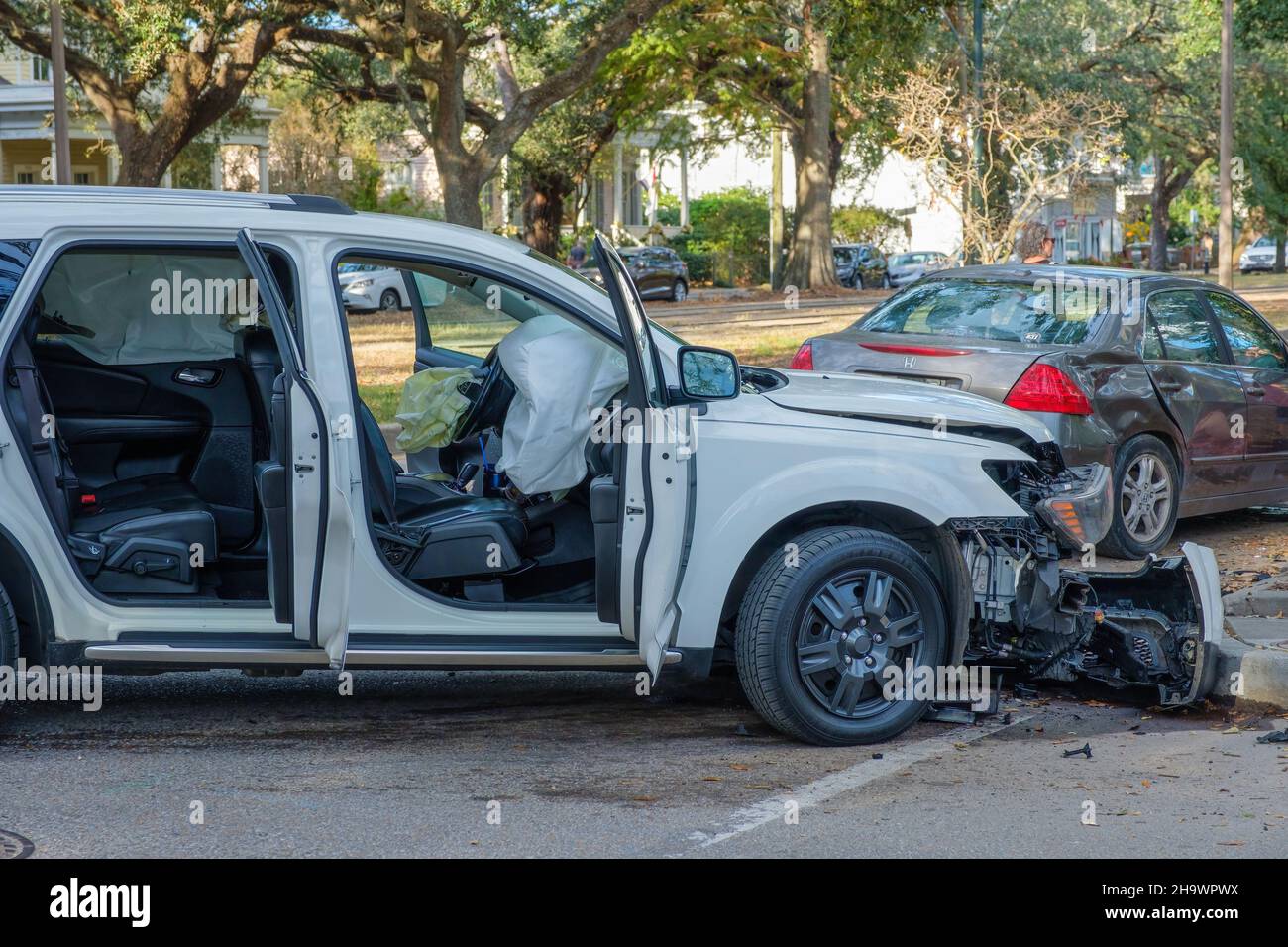 NEW ORLEANS, LA, USA - DECEMBER 5, 2021: Aftermath of a two-car collision on Carrollton Avenue showing deployed airbags Stock Photo