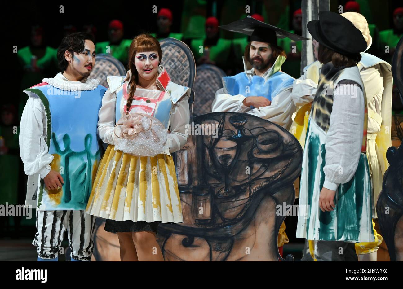 Meiningen, Germany. 07th Dec, 2021. The soloists and the choir stand on the stage of the Staatstheater Meiningen during a rehearsal for the opera 'La Bohème' by Giacomo Puccini (1885-1924). For his directorial debut, the 80-year-old painter and sculptor Markus Lüpertz also designed the stage set and costumes. The premiere at the State Theatre in the small Thuringian town is on 10 December. Credit: Martin Schutt/dpa-Zentralbild/dpa/Alamy Live News Stock Photo