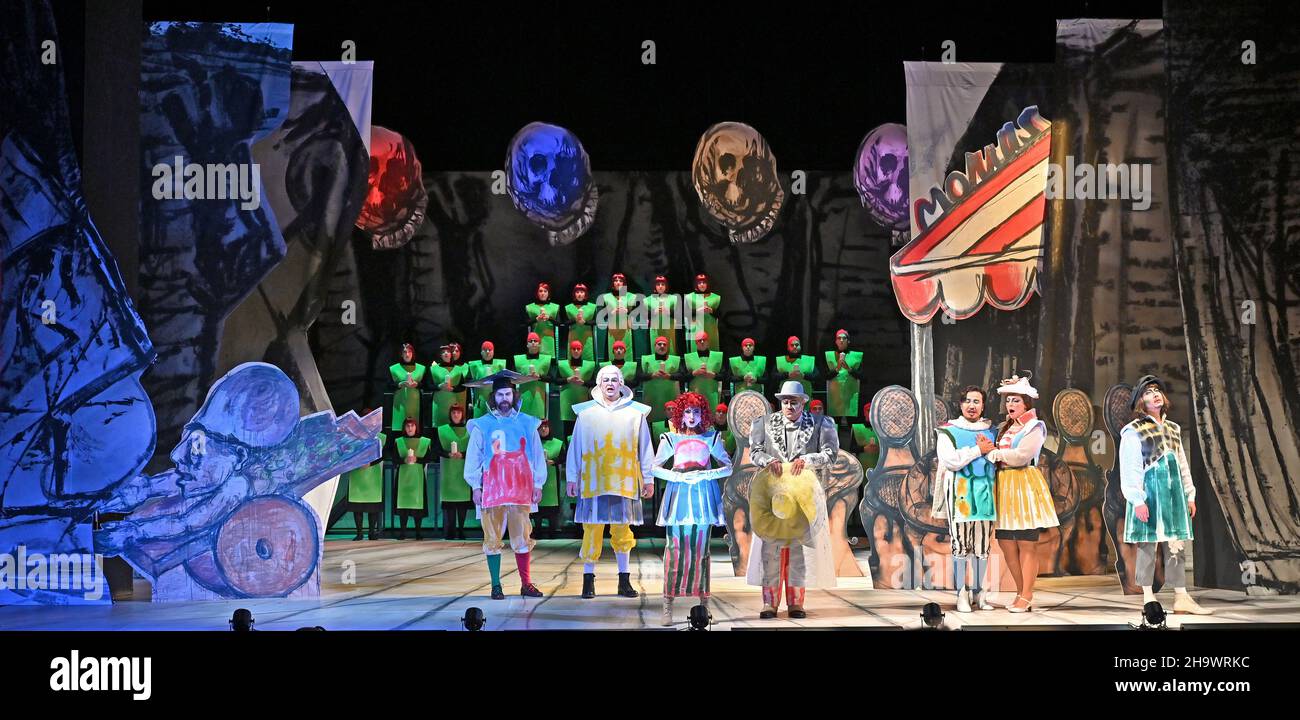 Meiningen, Germany. 07th Dec, 2021. The soloists and the choir stand on the stage of the Staatstheater Meiningen during a rehearsal for the opera 'La Bohème' by Giacomo Puccini (1885-1924). For his directorial debut, the 80-year-old painter and sculptor Markus Lüpertz also designed the stage set and costumes. The premiere at the State Theatre in the small Thuringian town is on 10 December. Credit: Martin Schutt/dpa-Zentralbild/dpa/Alamy Live News Stock Photo