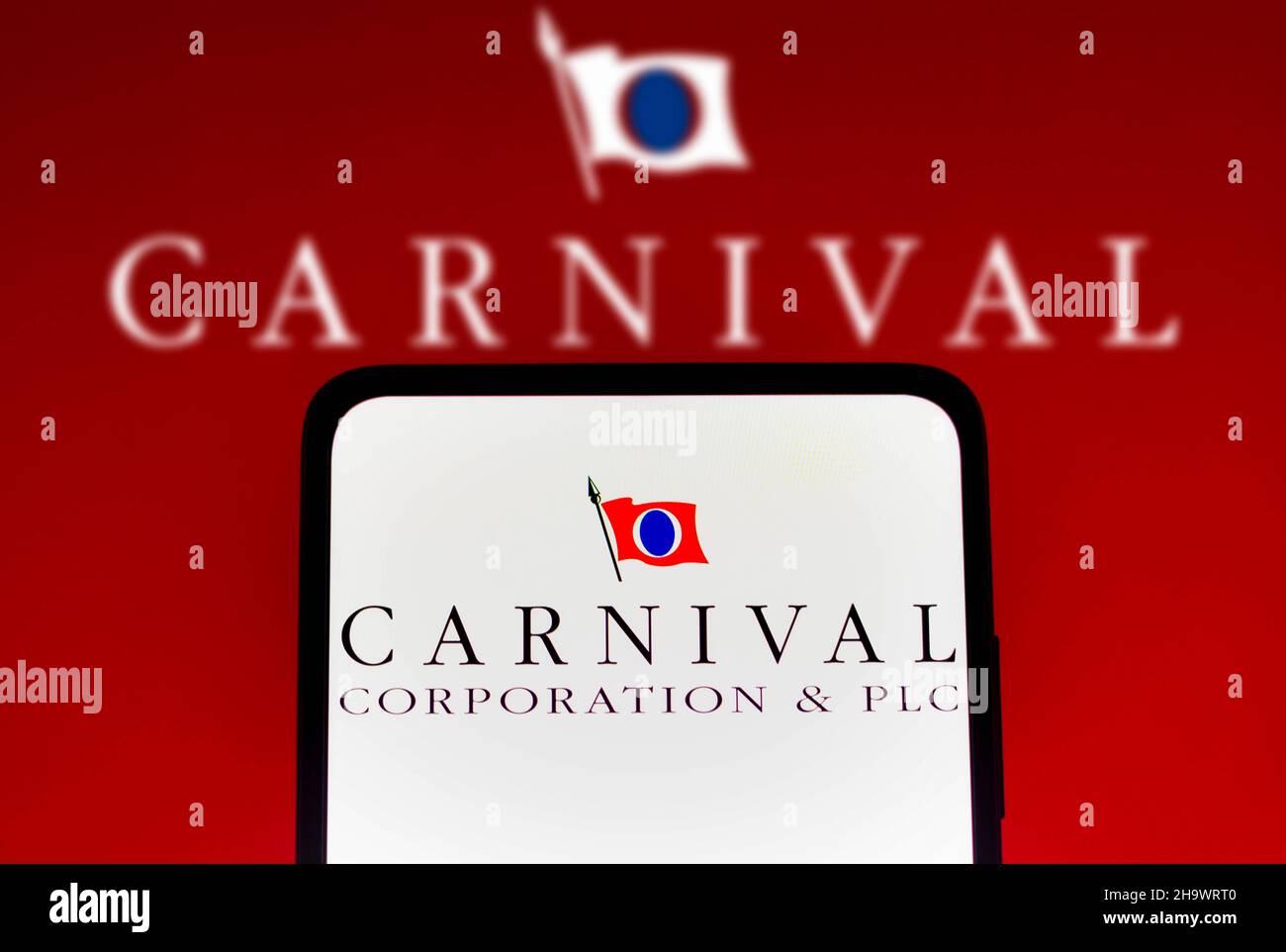 Brazil. 08th Dec, 2021. In this photo illustration the Carnival Corporation logo seen displayed on a smartphone and in the background. Credit: SOPA Images Limited/Alamy Live News Stock Photo