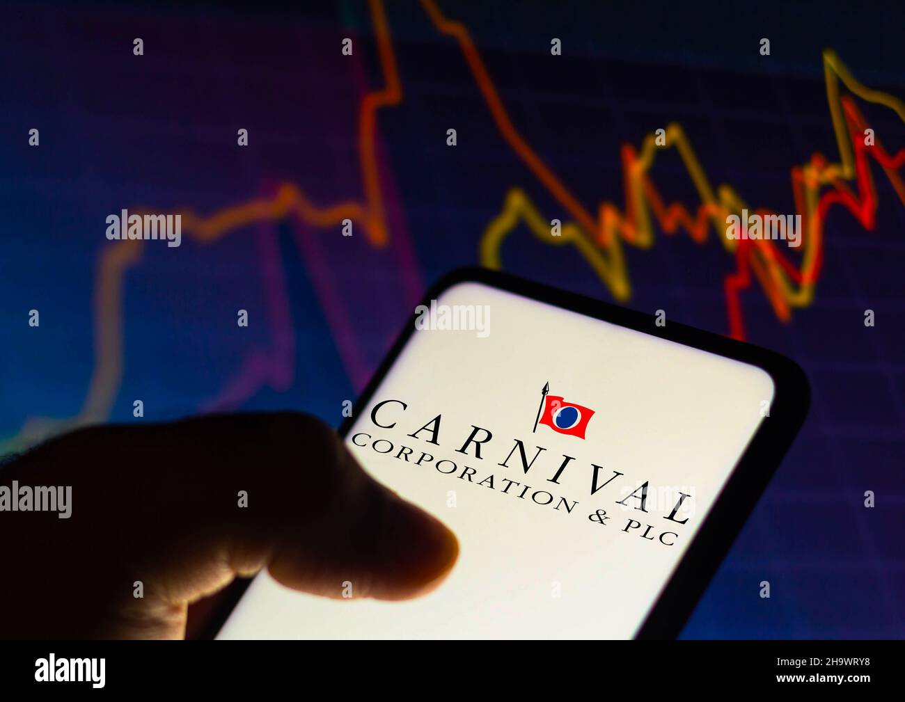 Brazil. 08th Dec, 2021. In this photo illustration the Carnival Corporation logo seen displayed on a smartphone with a stock market graph in the background. (Photo by Rafael Henrique/SOPA Images/Sipa USA) Credit: Sipa USA/Alamy Live News Stock Photo