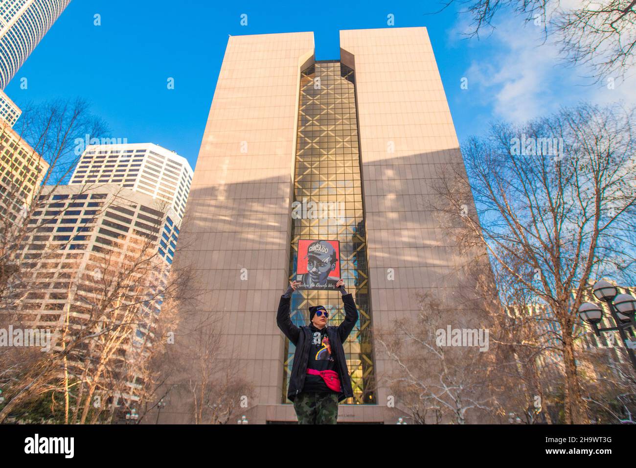 Minneapolis, United States. 08th Dec, 2021. Tanya James of Arkansas holds a portrait of Daunte Wright outside of the Hennepin County Courthouse during the opening arguments of the Kim Potter trial on December 8, 2021 in Minneapolis, Minnesota. Photo by Chris Tuite/imageSPACE Credit: Imagespace/Alamy Live News Stock Photo