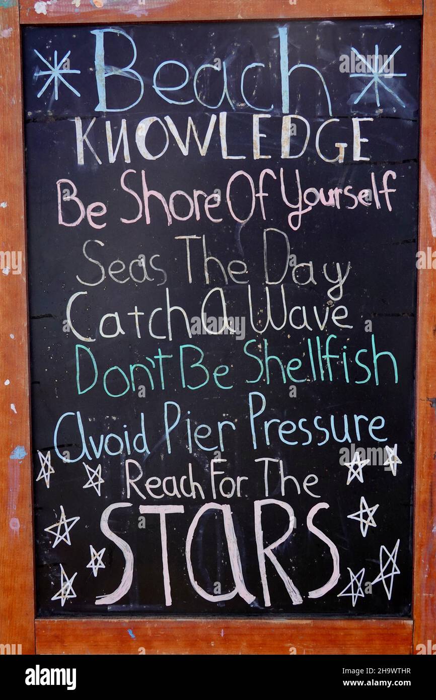 A beach lifestyle message written on a chalkboard Stock Photo - Alamy
