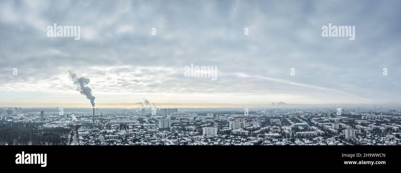 aerial panoramic view of Minsk city, covered by snow in cold winter day. winter cityscape under overcast sky. Stock Photo