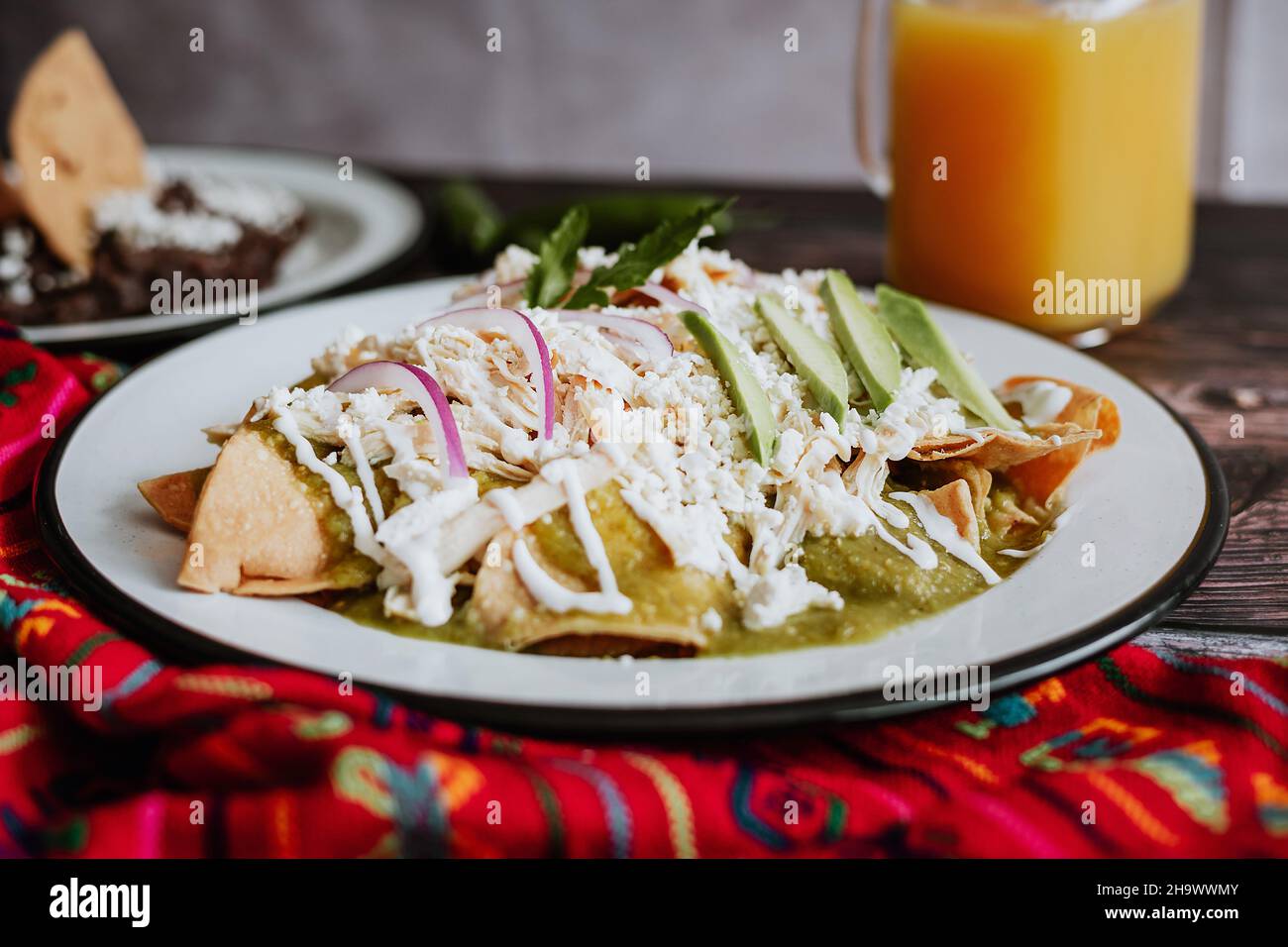 Mexican green chilaquiles with chicken and spicy green sauce traditional breakfast in Mexico