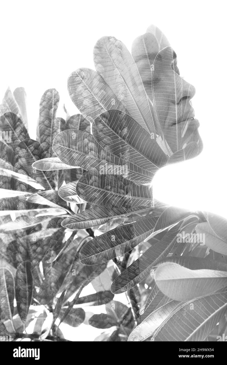 A portrait of a woman combined with tropical nature in a double ...