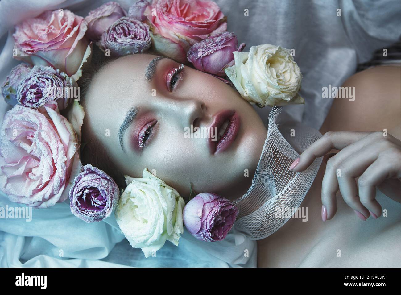 Close-up portrait of a woman with roses Stock Photo - Alamy