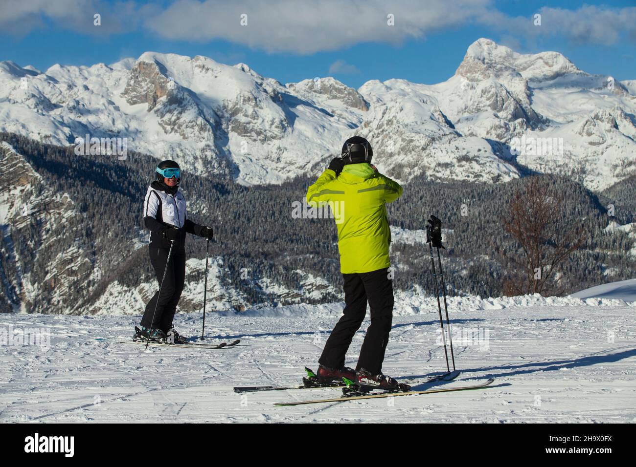 Bohinj, Slovenia. 7th Dec, 2021. Two Skiers take photos at Vogel ski center  in Bohinj, Slovenia, Dec. 7, 2021. The ski season in Slovenia has begun  from last weekend as tourists and