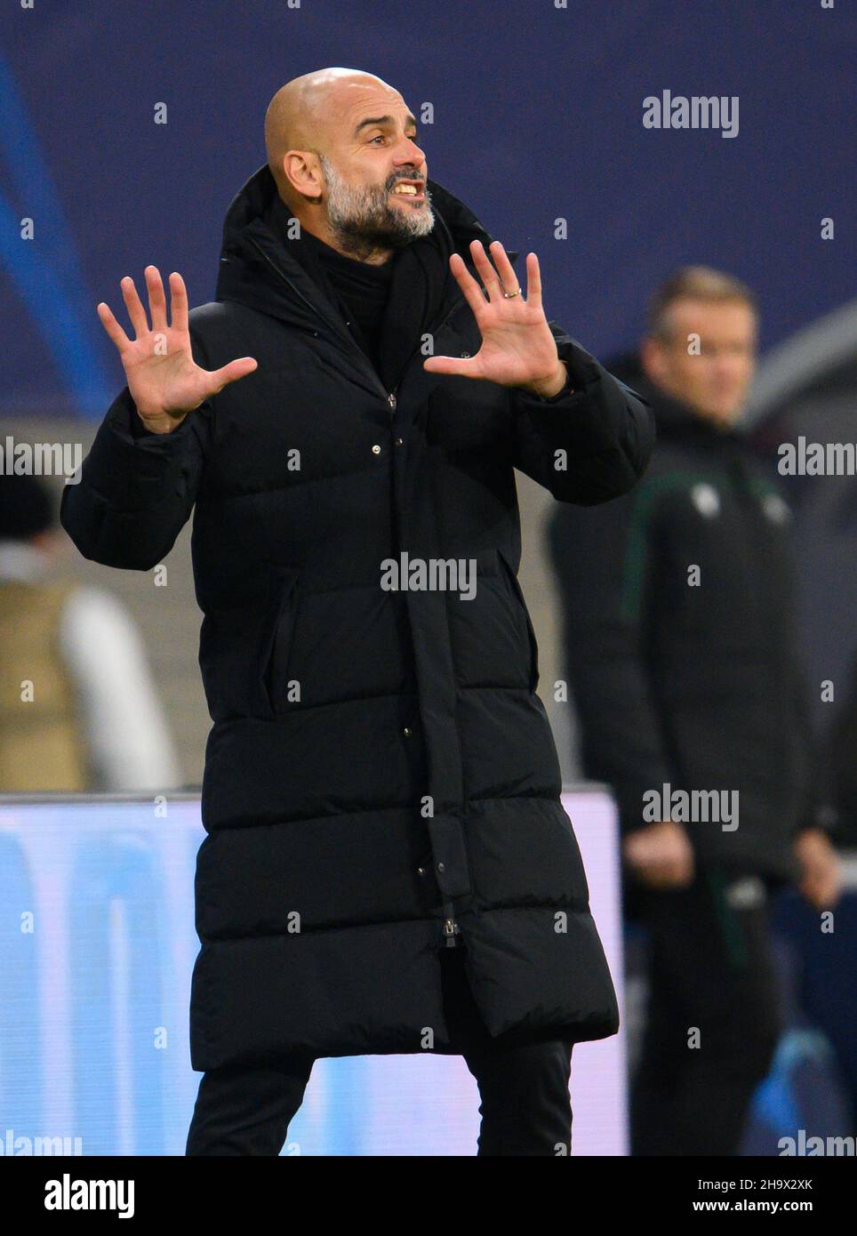 Leipzig, Germany. 07th Dec, 2021. Football: Champions League, RB Leipzig - Manchester City, Group stage, Group A, Matchday 6, Red Bull Arena. Manchester's coach Pep Guardiola gestures. Credit: Robert Michael/dpa-Zentralbild/dpa/Alamy Live News Stock Photo