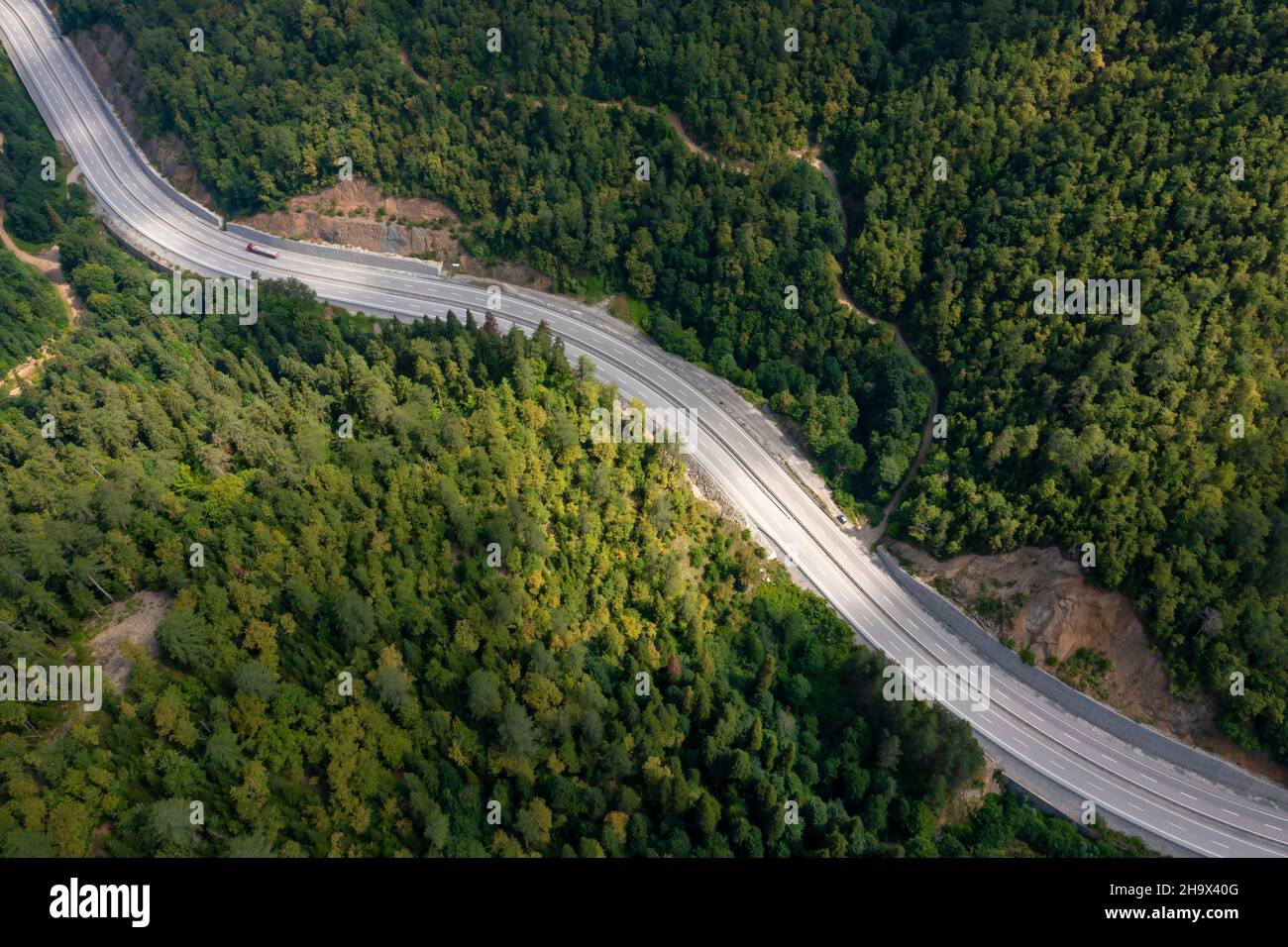 a road and vehicles in the black sea forests, Mengen, Turkey Stock Photo