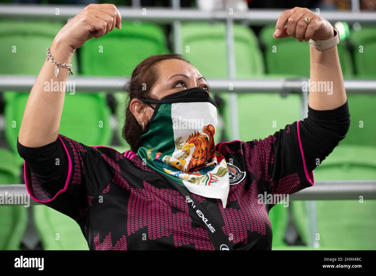 Austin, Texas, USA. 8th December, 2021. Mexico fan cheers for her national team during the first half of a Mexico vs. Chile friendly at Austin's Q2 Stadium. The teams battled to a 2-2- tie at the end of regulation time. Credit: Bob Daemmrich/Alamy Live News Stock Photo