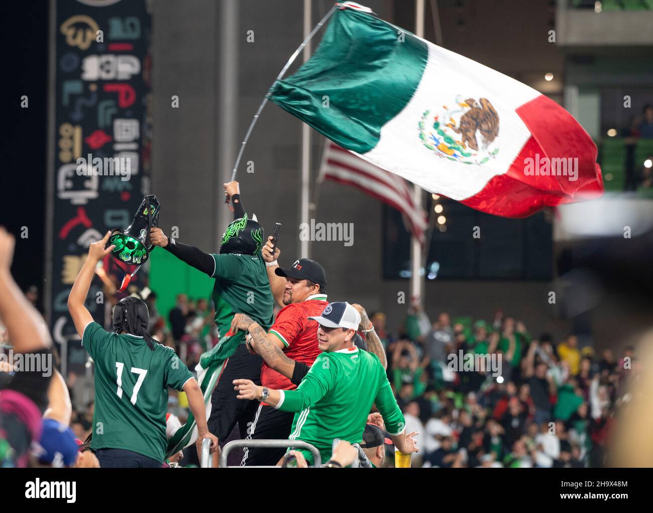 Austin, Texas, USA. 8th December, 2021. Mexico fans cheer a second half goal in a Mexico National Team vs. Chile friendly at Austin's Q2 Stadium. The teams were tied, 2-2 after regulation play. Credit: Bob Daemmrich/Alamy Live News Stock Photo