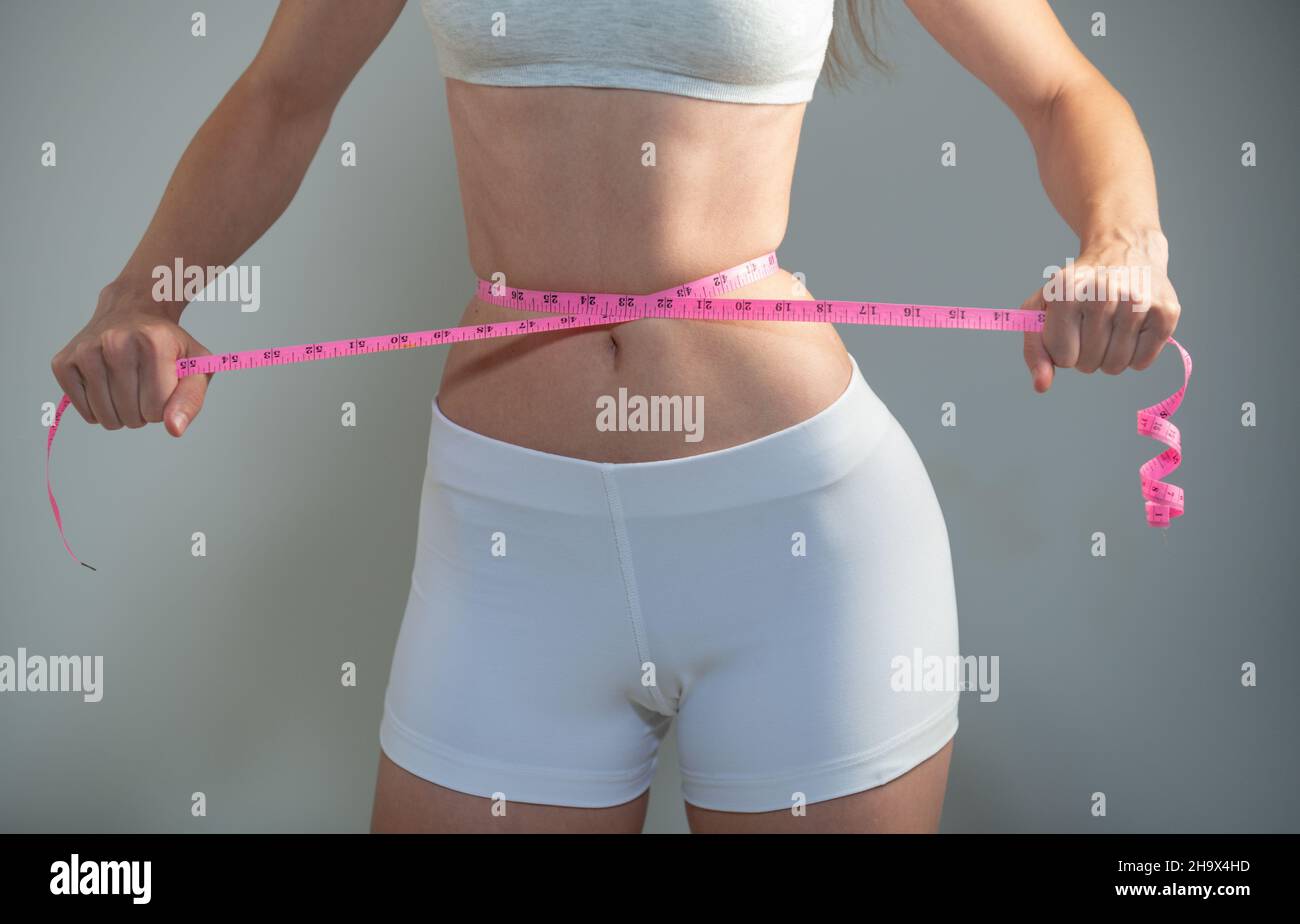 Waist tape measure woman hi-res stock photography and images - Alamy