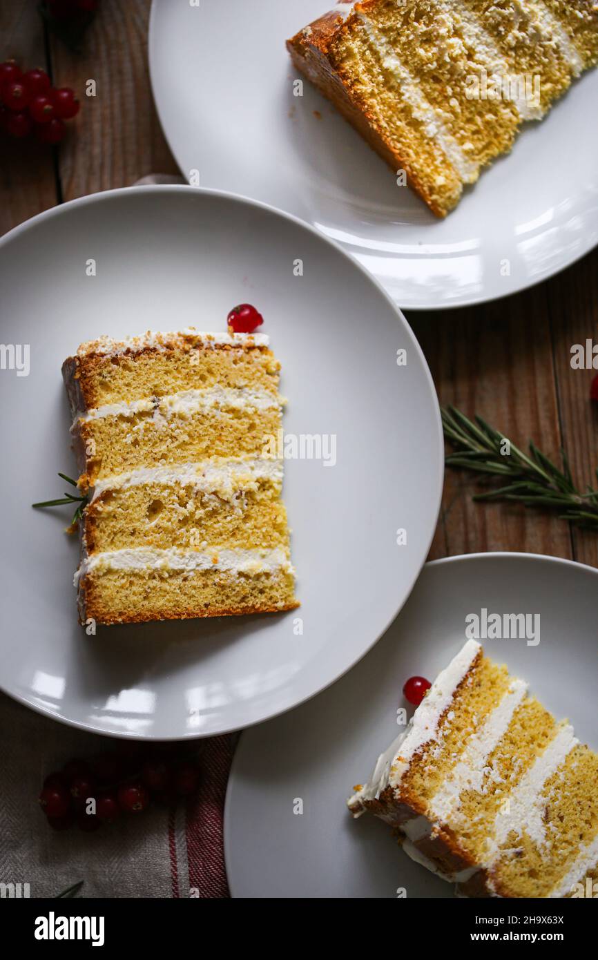 Orange, cardamom and rose water cream frosting layer cake Stock Photo