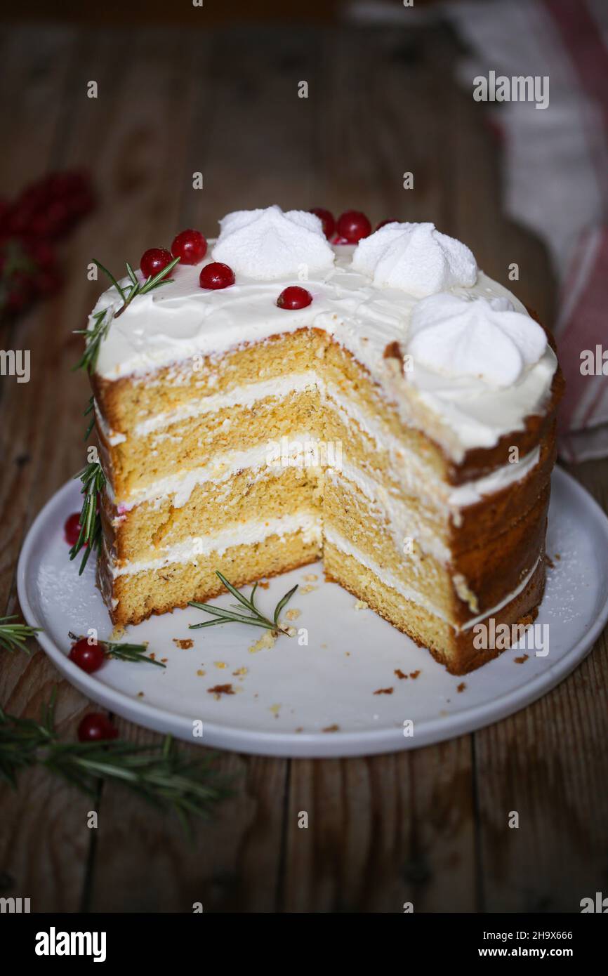 Orange, cardamom and rose water cream frosting layer cake Stock Photo