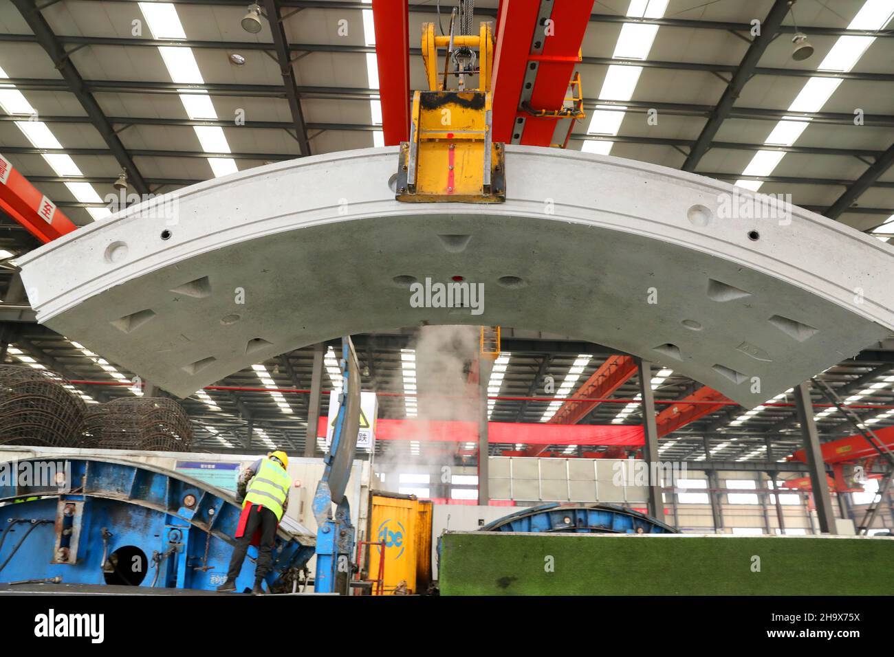 Nantong, Nantong, China. 9th Dec, 2021. On December 7, 2021, workers from Jiangsu Nantong Railway Construction Construction Component Co., Ltd. were busy processing the largest single shield segment in China in the workshop. According to reports, the current Nantong Railway Construction component has been the production of the 3115 ring of shield segments for the Yangtze River shield crossing project known as ''the first long tunnel of the Yangtze River in Wanli'', and the 1993 ring has been installed. The China-Russia East Route Natural Gas Pipeline Yangtze River Shield Crossing Project co Stock Photo