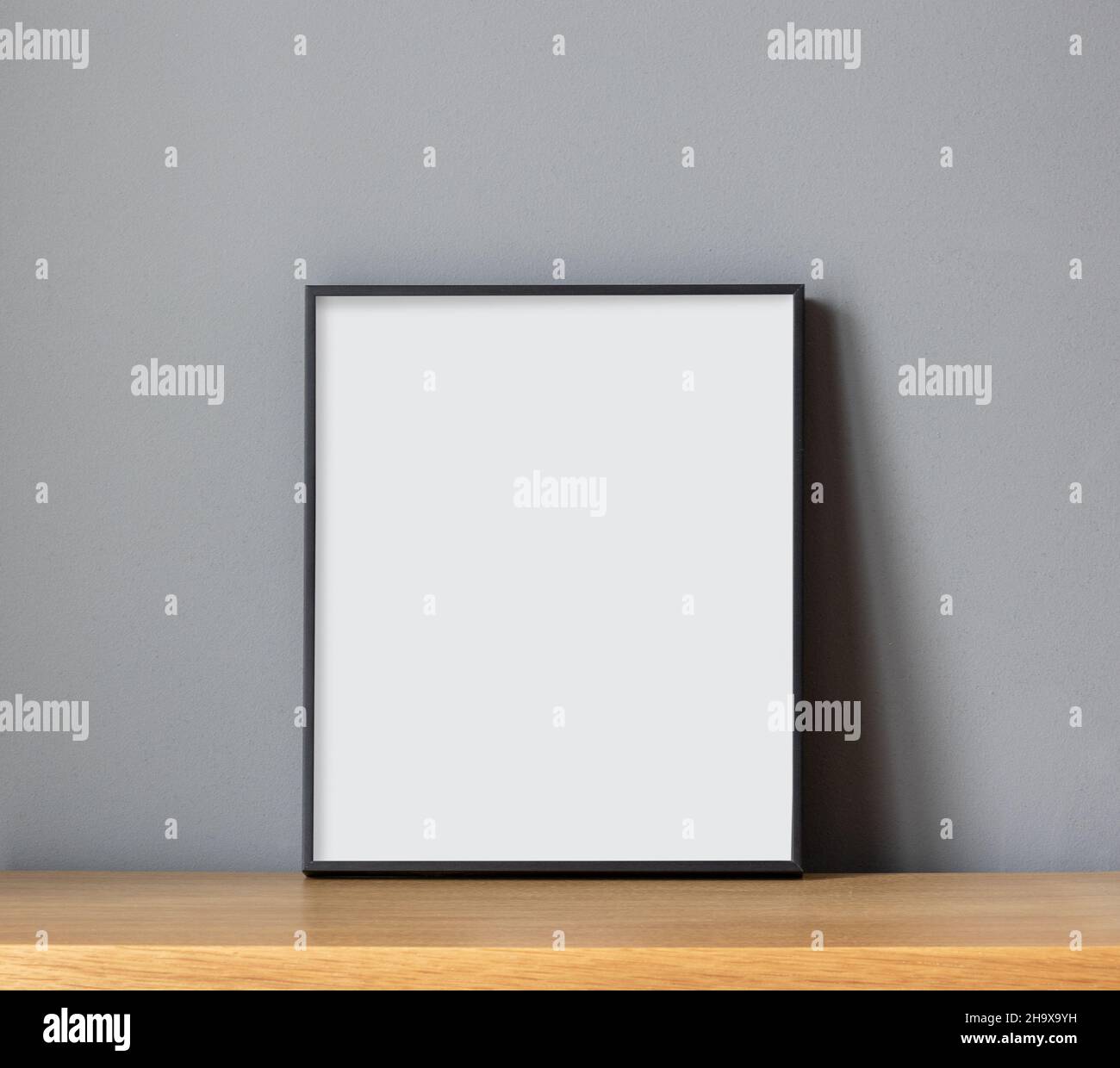 empty frame on wooden shelf on grey wall background Stock Photo - Alamy