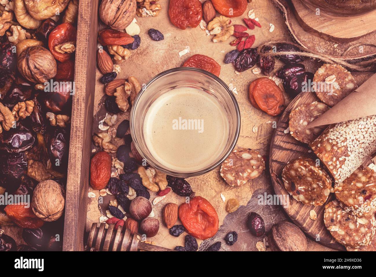 coffee and dried fruits. hearthealthy foods, dried apricots, nuts, homemade sweets of oatmeal
