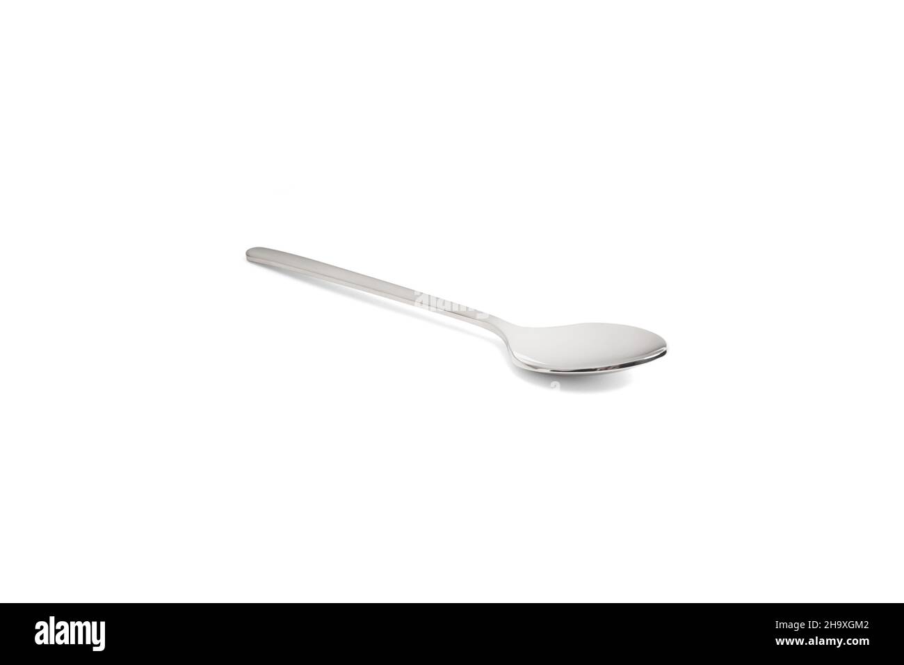 Clean shiny metal spoon isolated on white. Stainless steel small kitchen  dessert teaspoon cut close up. Tablespoon. Kitchen utensils concept. Set of  realistic spoons from different points of view Stock Photo by ©