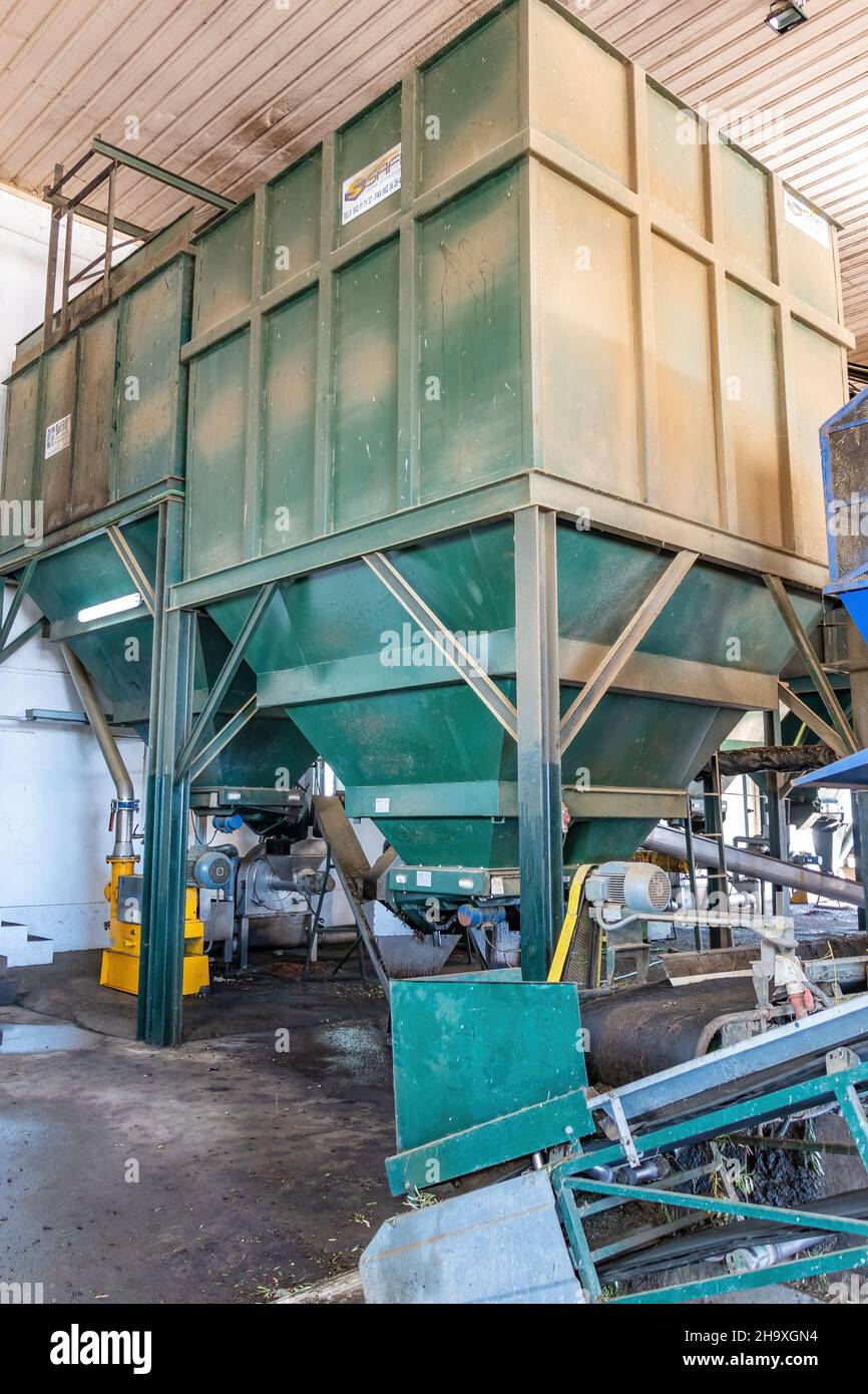 Huelva, Spain - December 04,2021: Artisan olive oil processing machinery Stock Photo