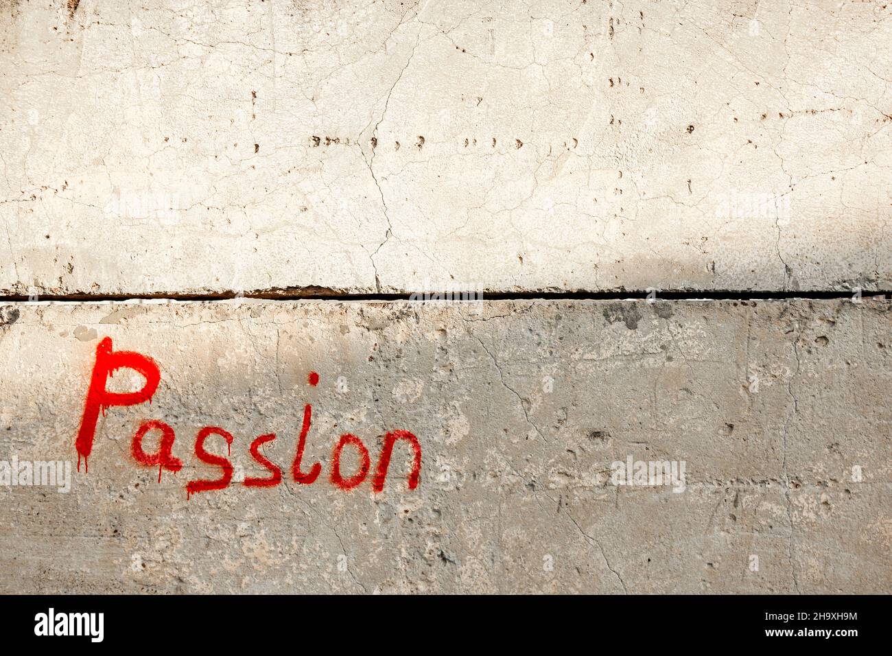 The word PASSION written with red paint on the wall Stock Photo Alamy