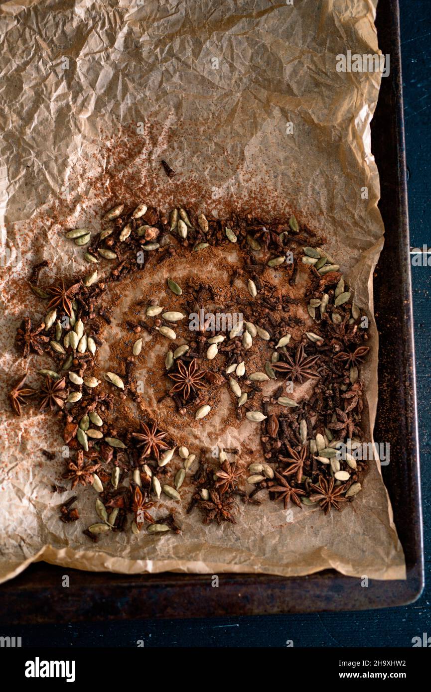 Various Christmas spices on baking paper Stock Photo