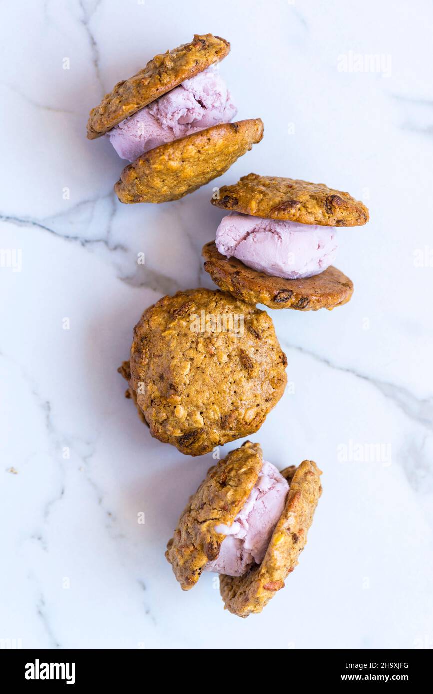 Oat cookie and strawberry ice cream sandwiches Stock Photo Alamy