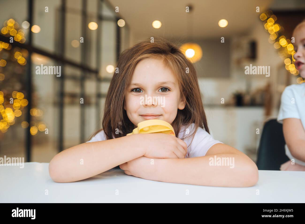 Adorable little girl looking at the camera close-up Stock Photo - Alamy