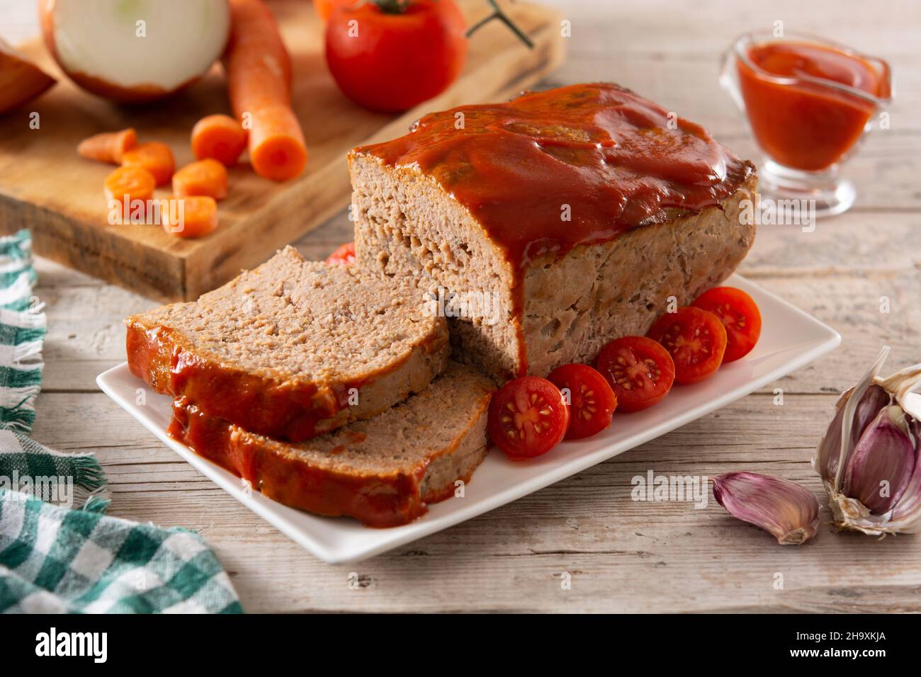 Traditional American meatloaf with ketchup on wooden table Stock Photo Alamy