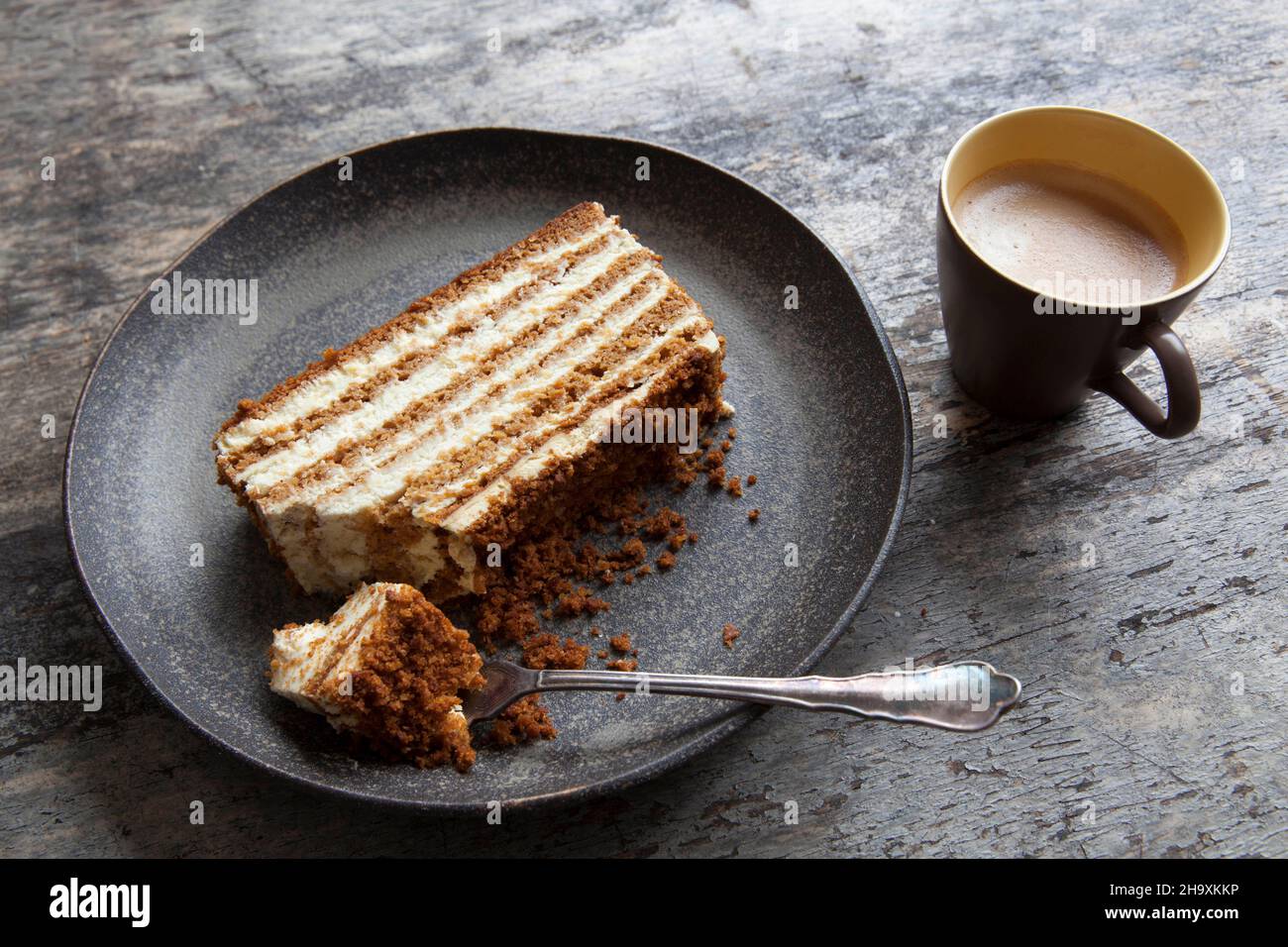 Layered honey cake and coffee Stock Photo Alamy