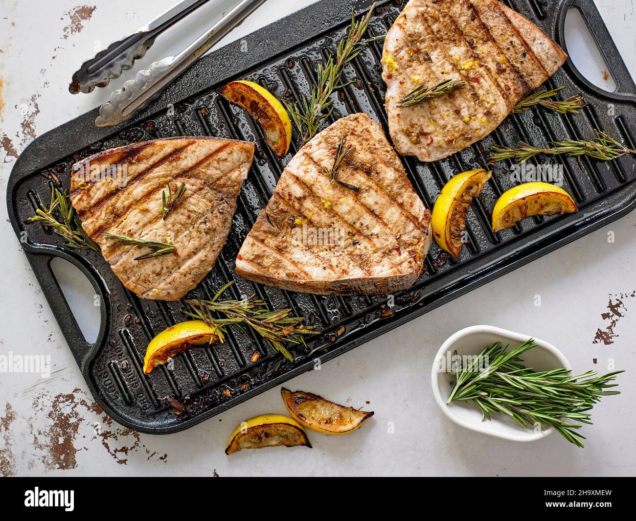 Grilled Marinated Swordfish Steaks with Lemon and Rosemary Stock Photo