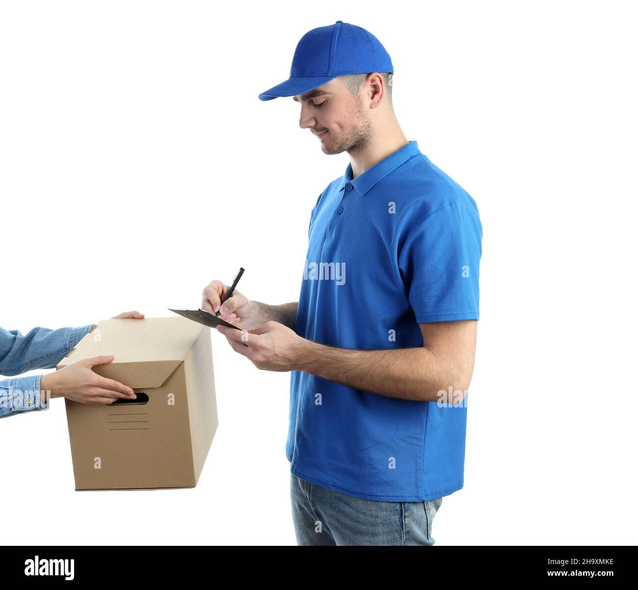 Delivery man makes a note on clipboard, isolated on white Stock Photo ...