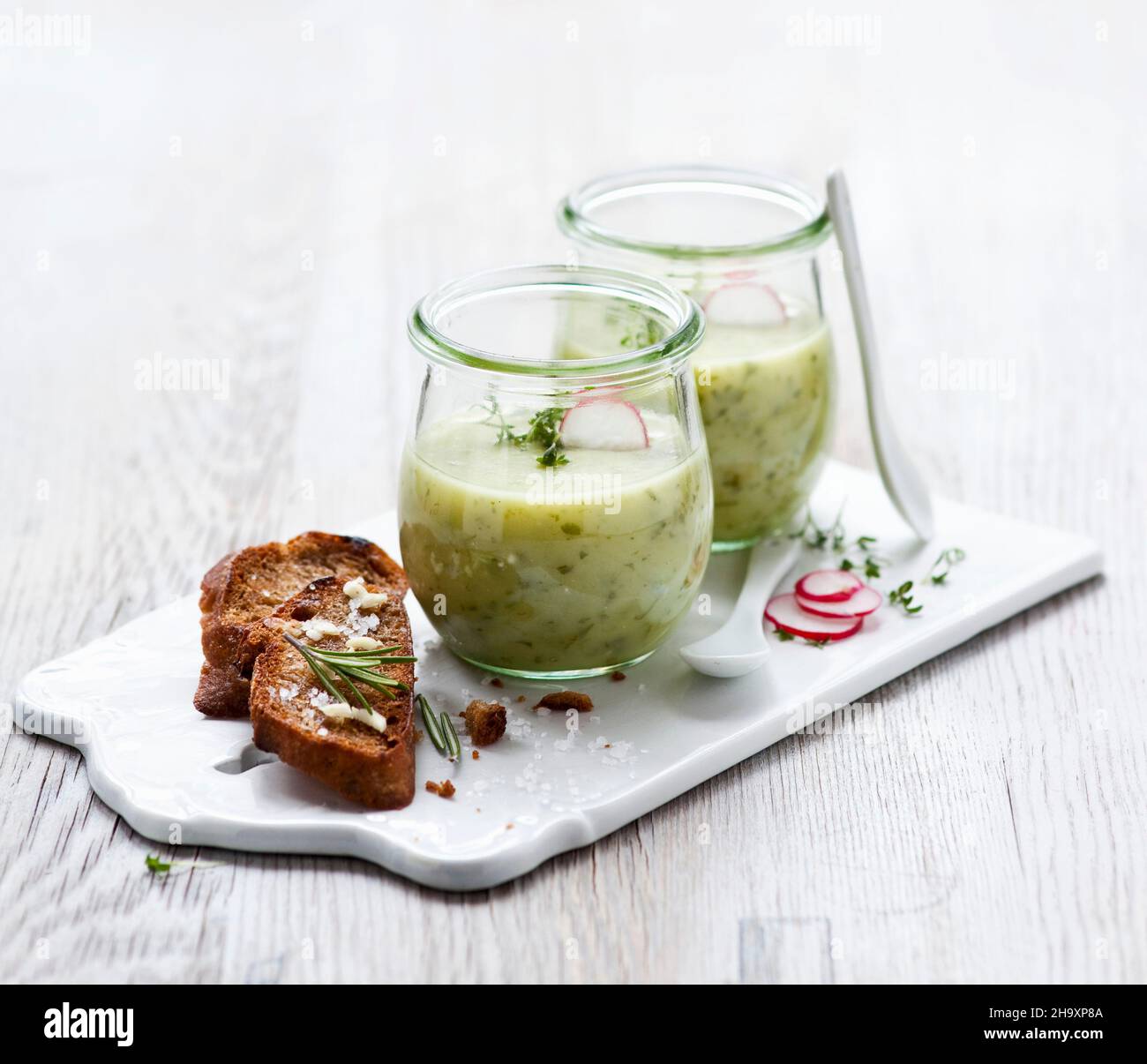 Herb and potato soup in glasses Stock Photo Alamy